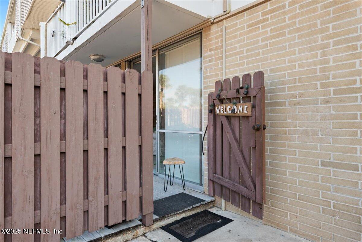 901 Ocean Boulevard, Unit 1 Atlantic Beach, FL 32233 - Photo 4 of 39 a view of a wooden door with a glass door