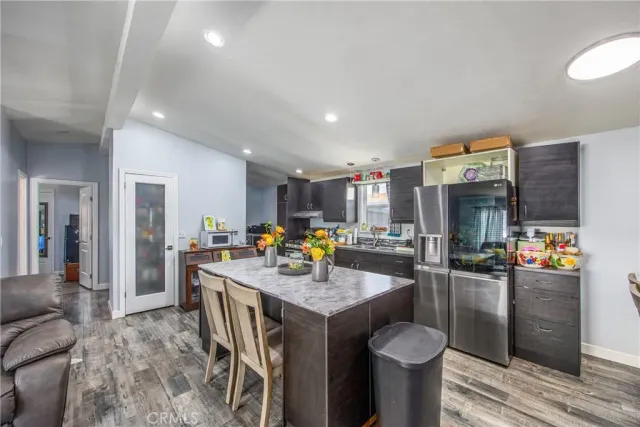 a view of a kitchen and dining area with furniture
