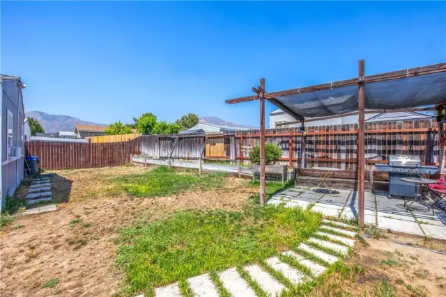 a view of a backyard with a patio