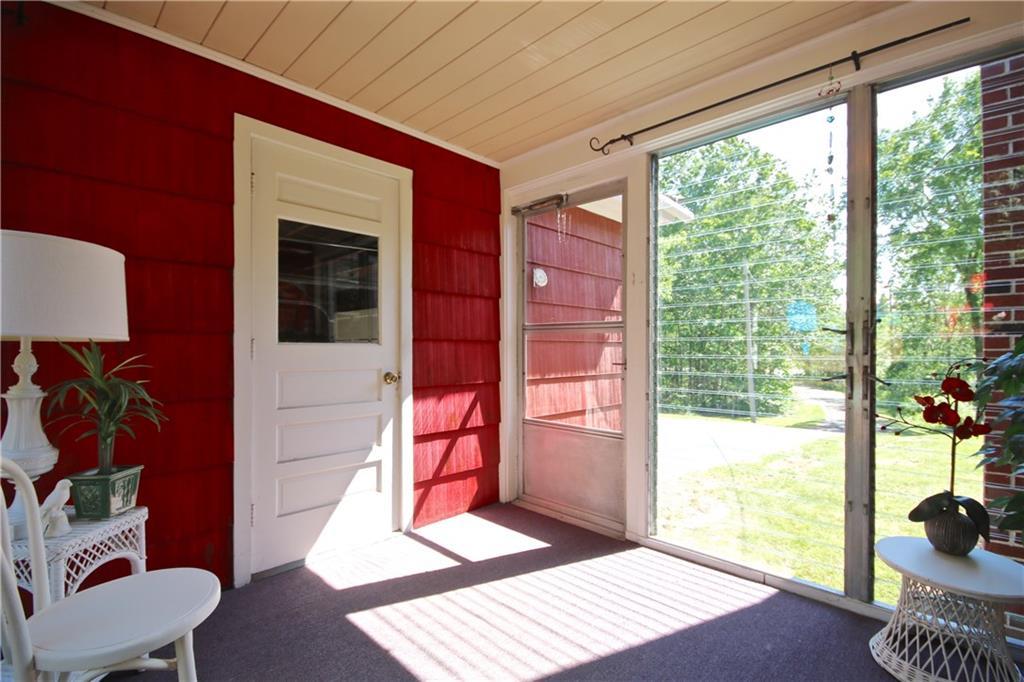 115 Sebago Lake Road Gorham, ME 04038 - Photo 11 of 35 Breezeway with louvered glass...