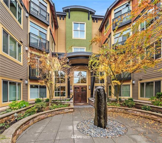 a front view of a brick building with many windows