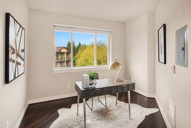a workspace with furniture and a window