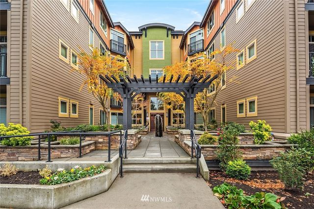 a couple of cars parked in front of a building