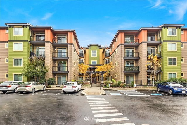 a view of a parked cars in front of a building