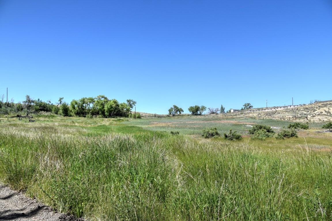 Tbd Sunnyside Road Montrose, CO 81401 - Photo 19 of 21 a view of a lake with a yard
