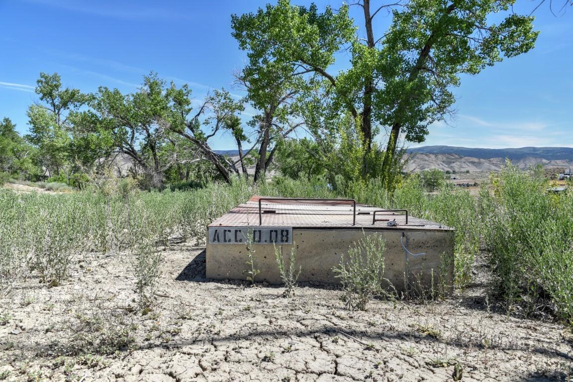 Tbd Sunnyside Road Montrose, CO 81401 - Photo 20 of 21 a view of a wooden house with a yard