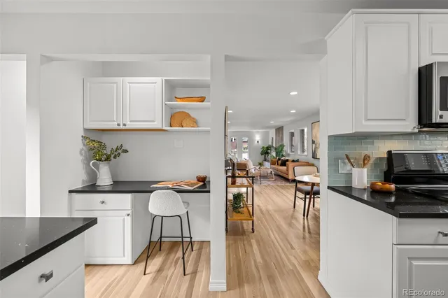 a view of kitchen with sink dining table and chairs