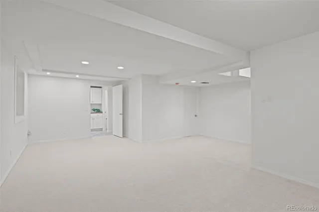 a bathroom with a sink a mirror and a vanity