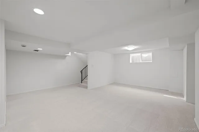 a view of a patio with table and chairs potted plants with wooden fence