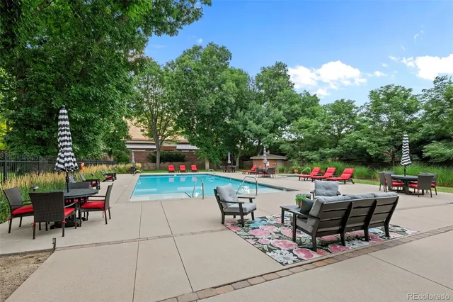 a house view with a sitting space and garden
