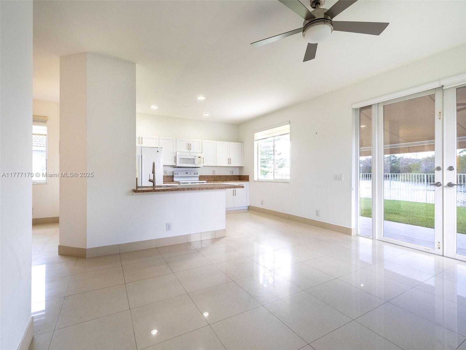 4242 Magnolia Ridge Drive Weston, FL 33331 - Photo 13 of 36 a view of a kitchen with a sink and windows