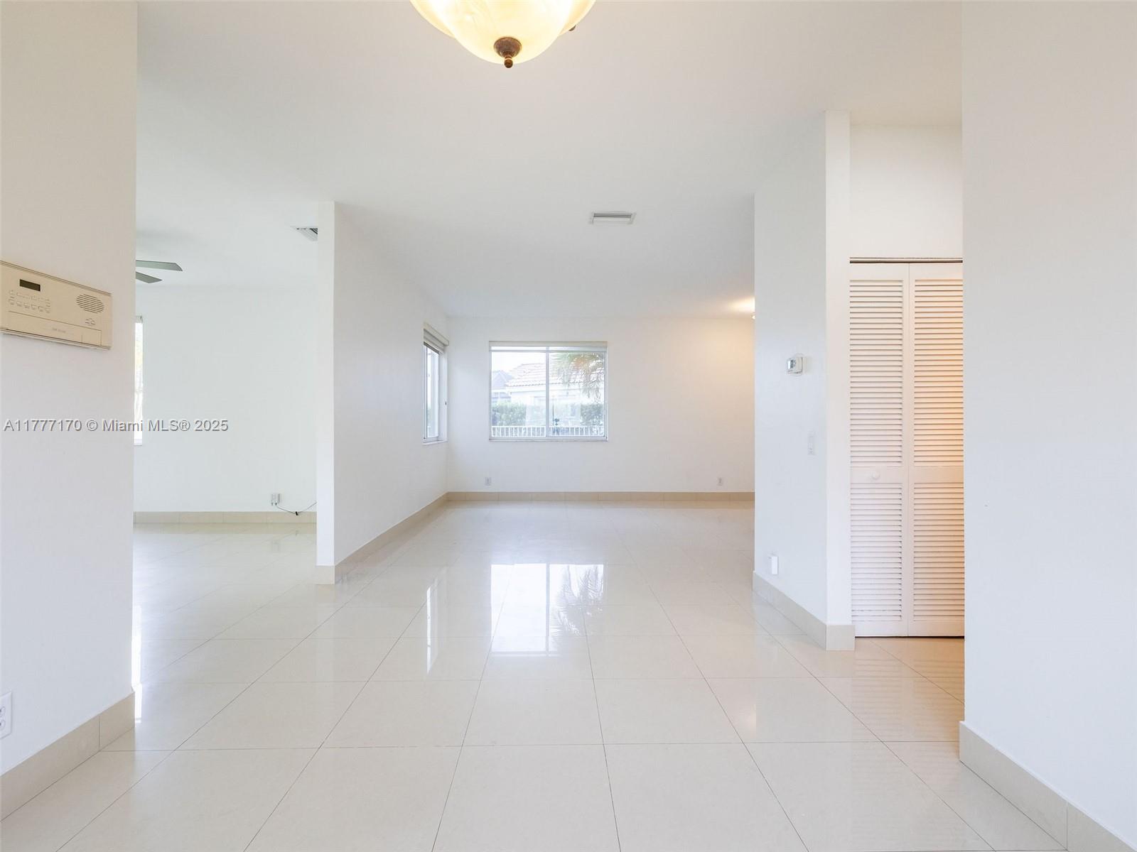 4242 Magnolia Ridge Drive Weston, FL 33331 - Photo 16 of 36 a view of an empty room with a window