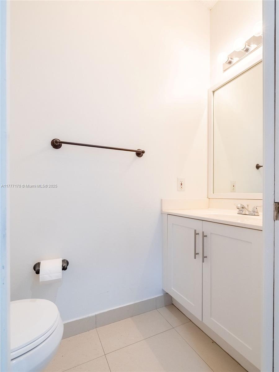 4242 Magnolia Ridge Drive Weston, FL 33331 - Photo 17 of 36 a bathroom with a sink a toilet and shower