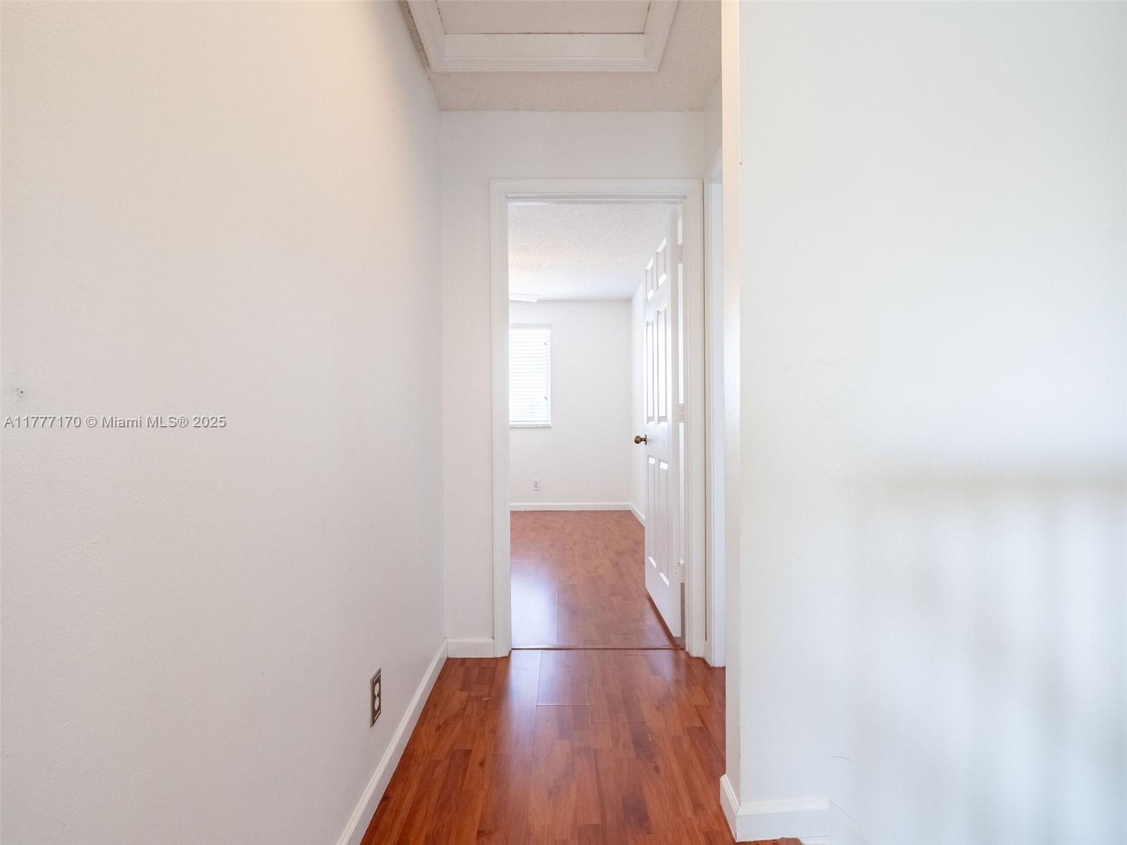 4242 Magnolia Ridge Drive Weston, FL 33331 - Photo 26 of 36 a view of hallway with wooden floor