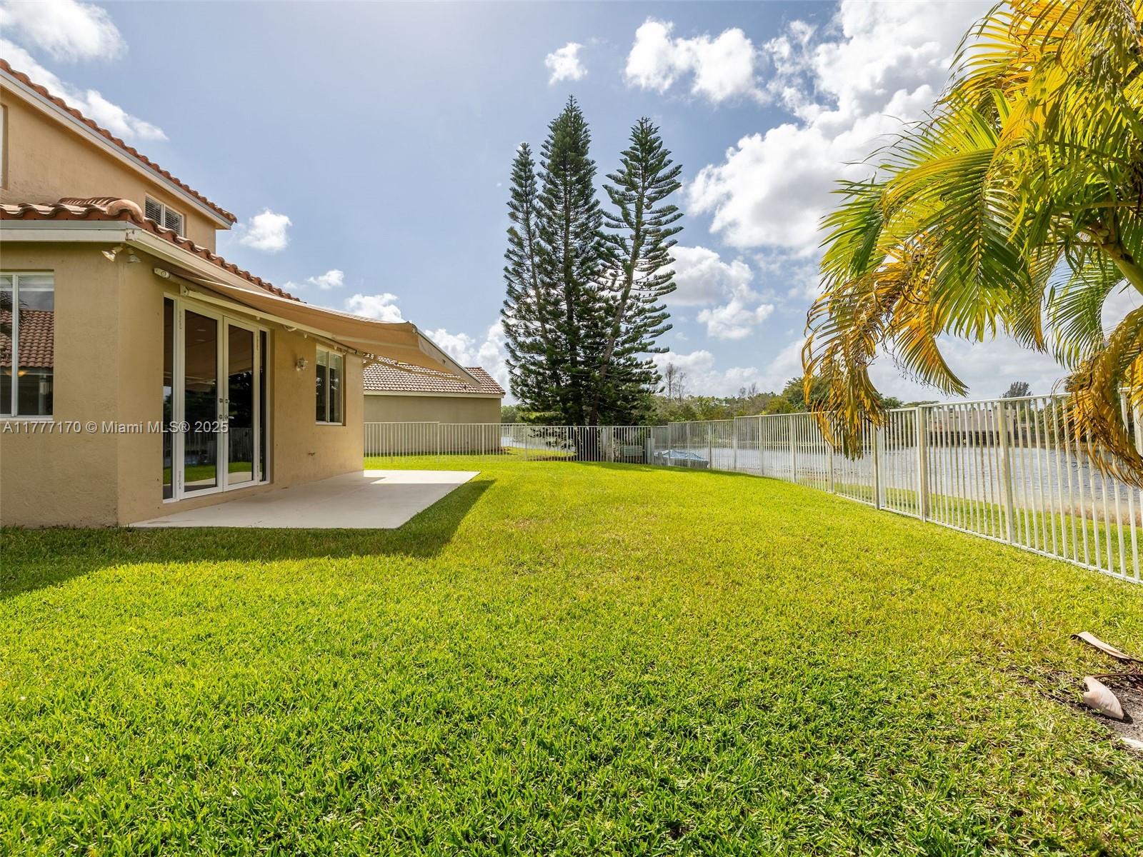 4242 Magnolia Ridge Drive Weston, FL 33331 - Photo 28 of 36 a view of swimming pool with an outdoor space and seating area