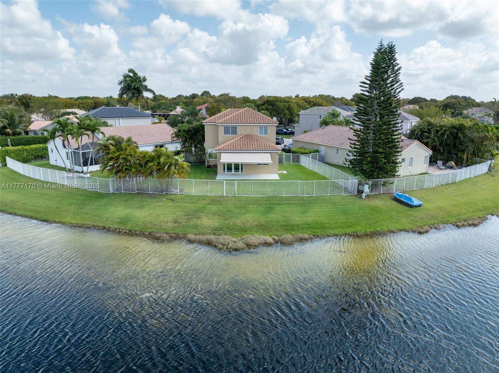 4242 Magnolia Ridge Drive Weston, FL 33331 - Photo 32 of 36 a view of a garden with a building in the background