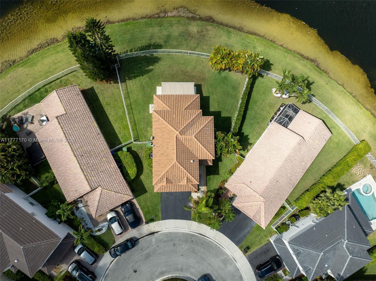 4242 Magnolia Ridge Drive Weston, FL 33331 - Photo 34 of 36 an aerial view of a house with outdoor space and a lake view