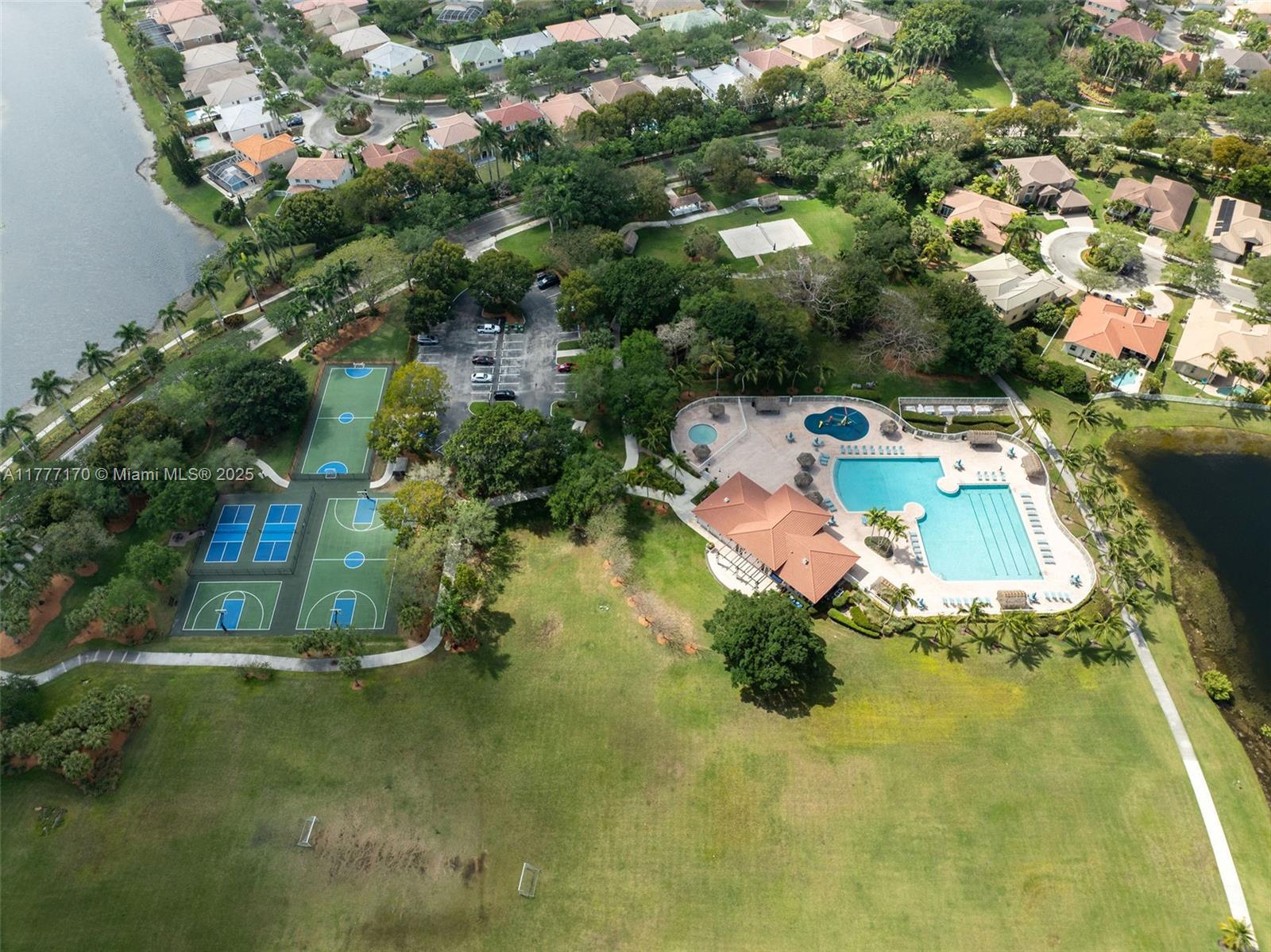 4242 Magnolia Ridge Drive Weston, FL 33331 - Photo 35 of 36 an aerial view of a house with swimming pool outdoor seating and yard