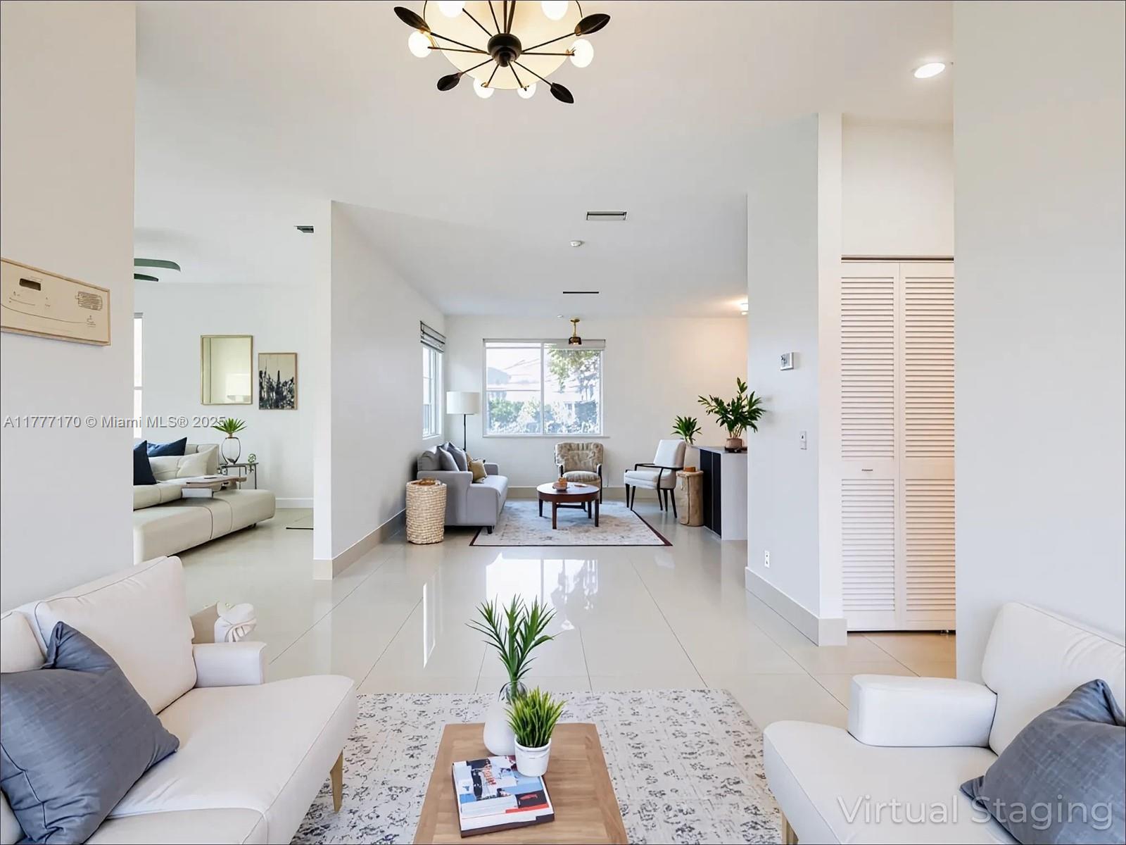 4242 Magnolia Ridge Drive Weston, FL 33331 - Photo 5 of 36 a living room with furniture and wooden floor