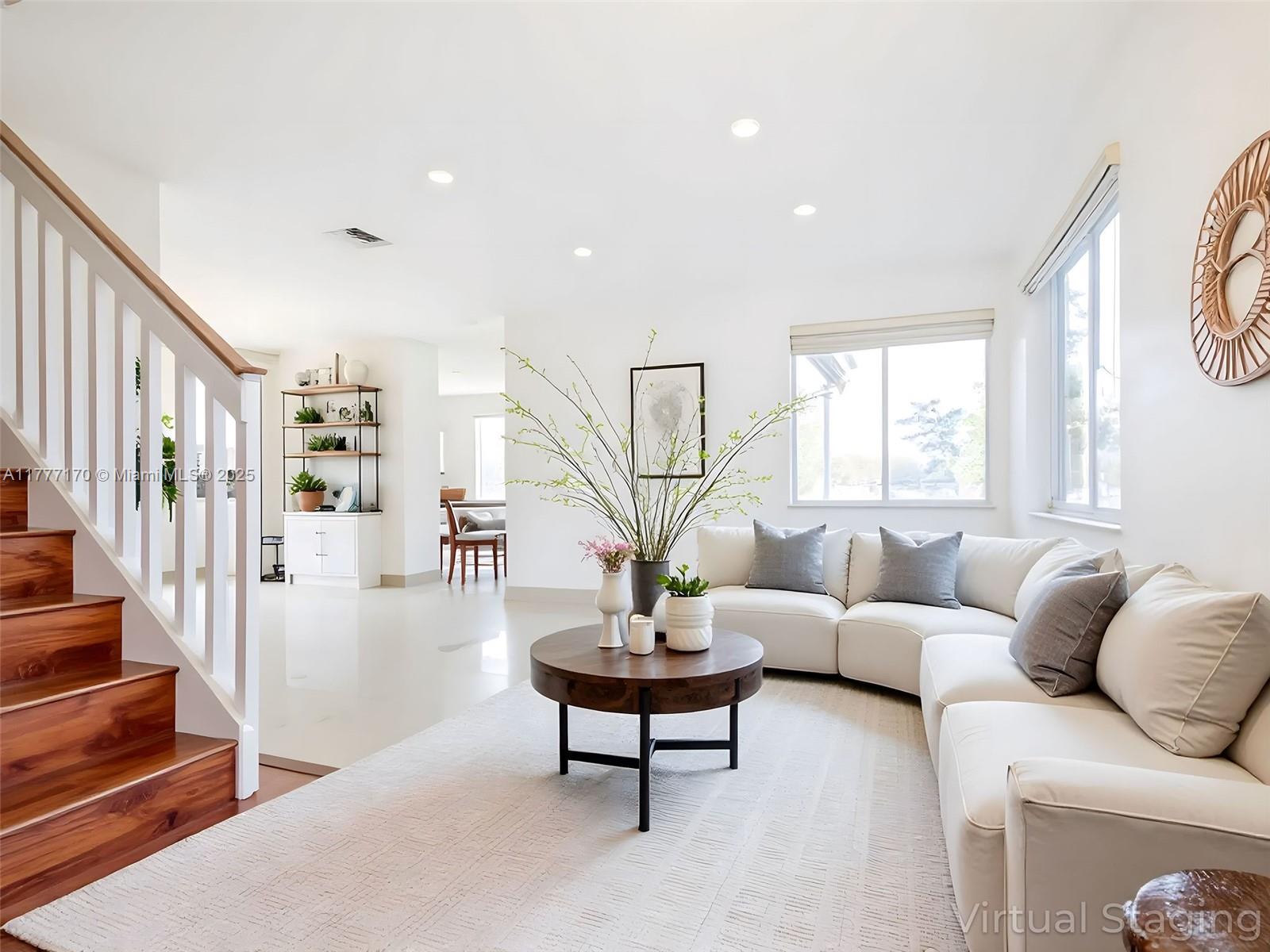 4242 Magnolia Ridge Drive Weston, FL 33331 - Photo 6 of 36 a living room with furniture a lamp and a large window
