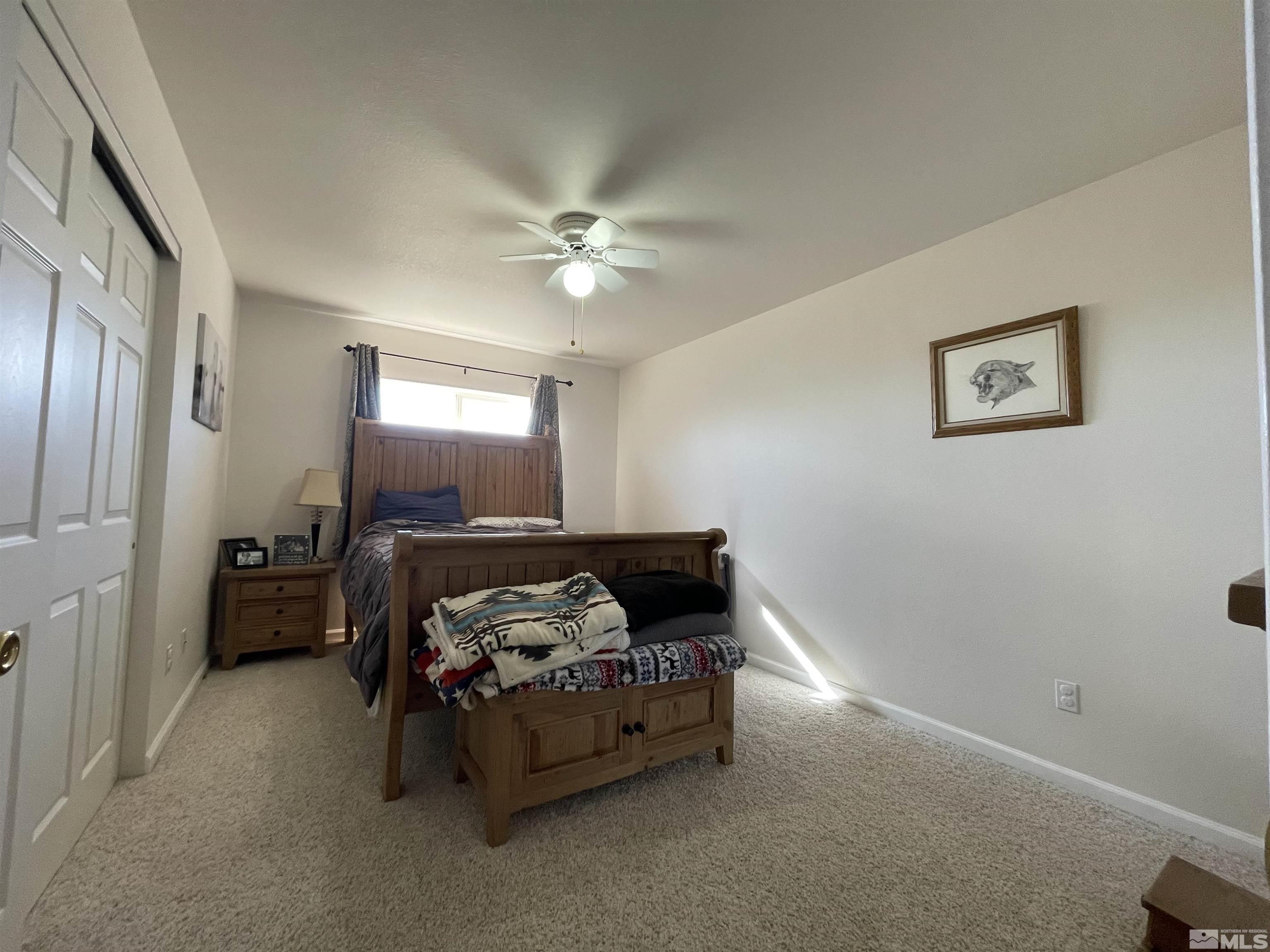 17 Mason Road Yerington, NV 89447 - Photo 14 of 36 a bedroom with bed and window