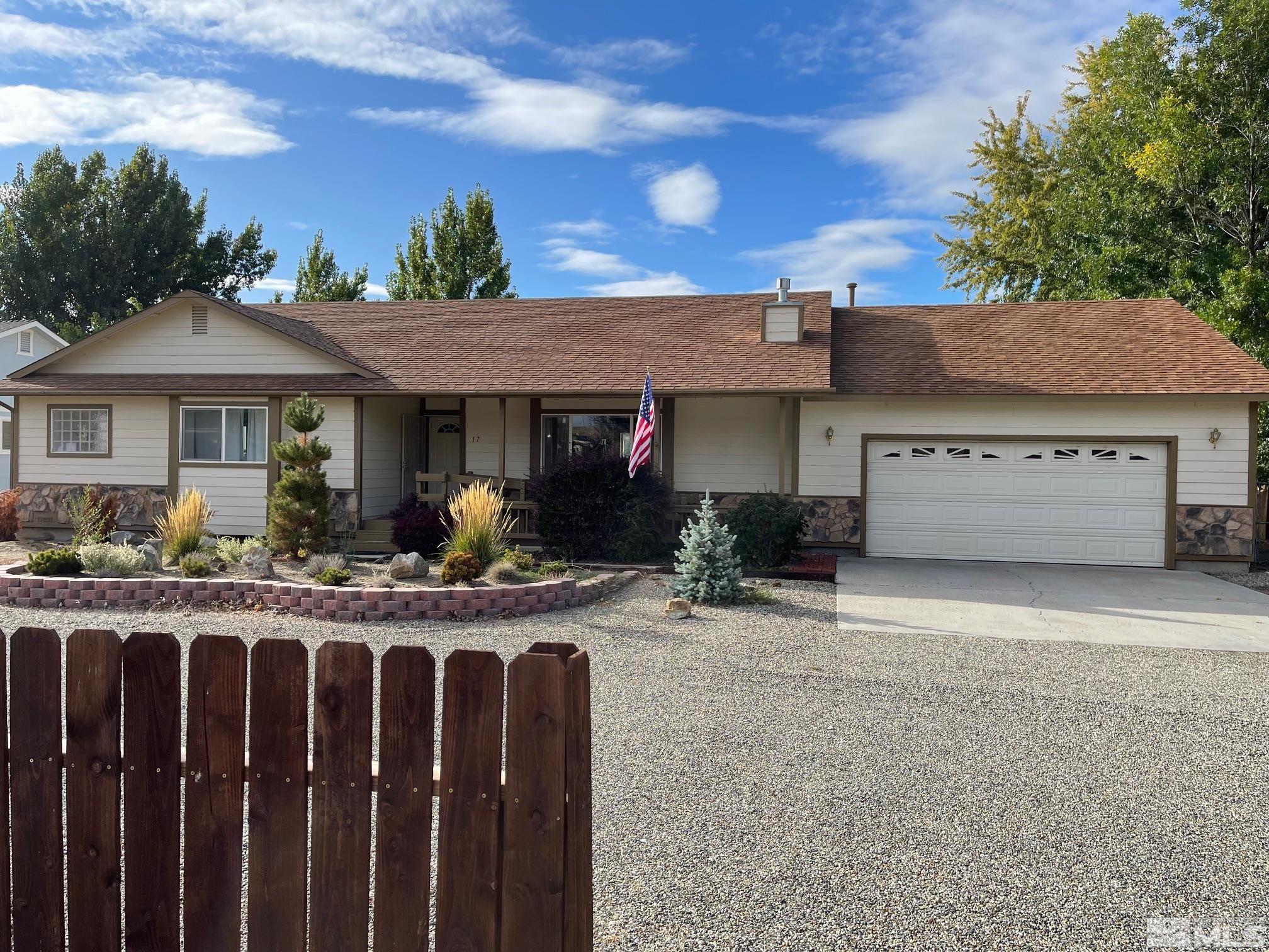 17 Mason Road Yerington, NV 89447 - Photo 2 of 36 a view of a house with wooden deck and a basket ball court