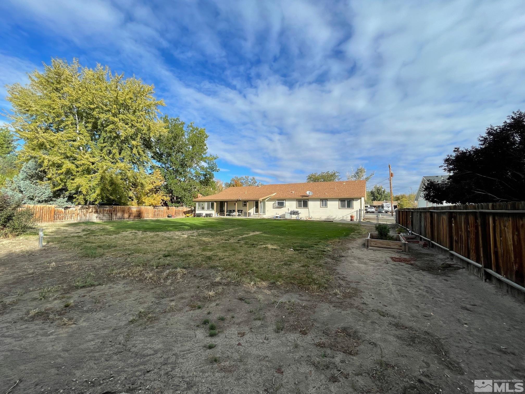 17 Mason Road Yerington, NV 89447 - Photo 32 of 36 a view of a yard with an trees