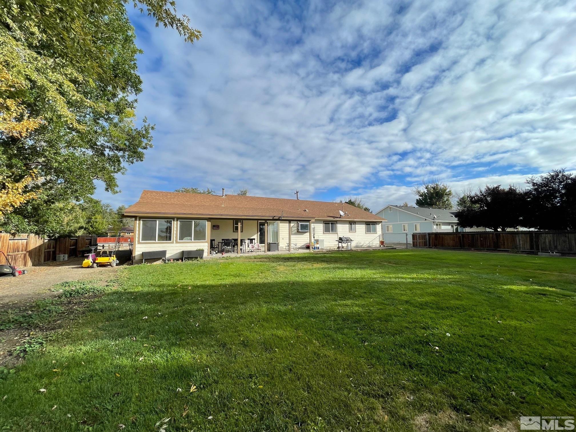 17 Mason Road Yerington, NV 89447 - Photo 4 of 36 a front view of a house with a garden
