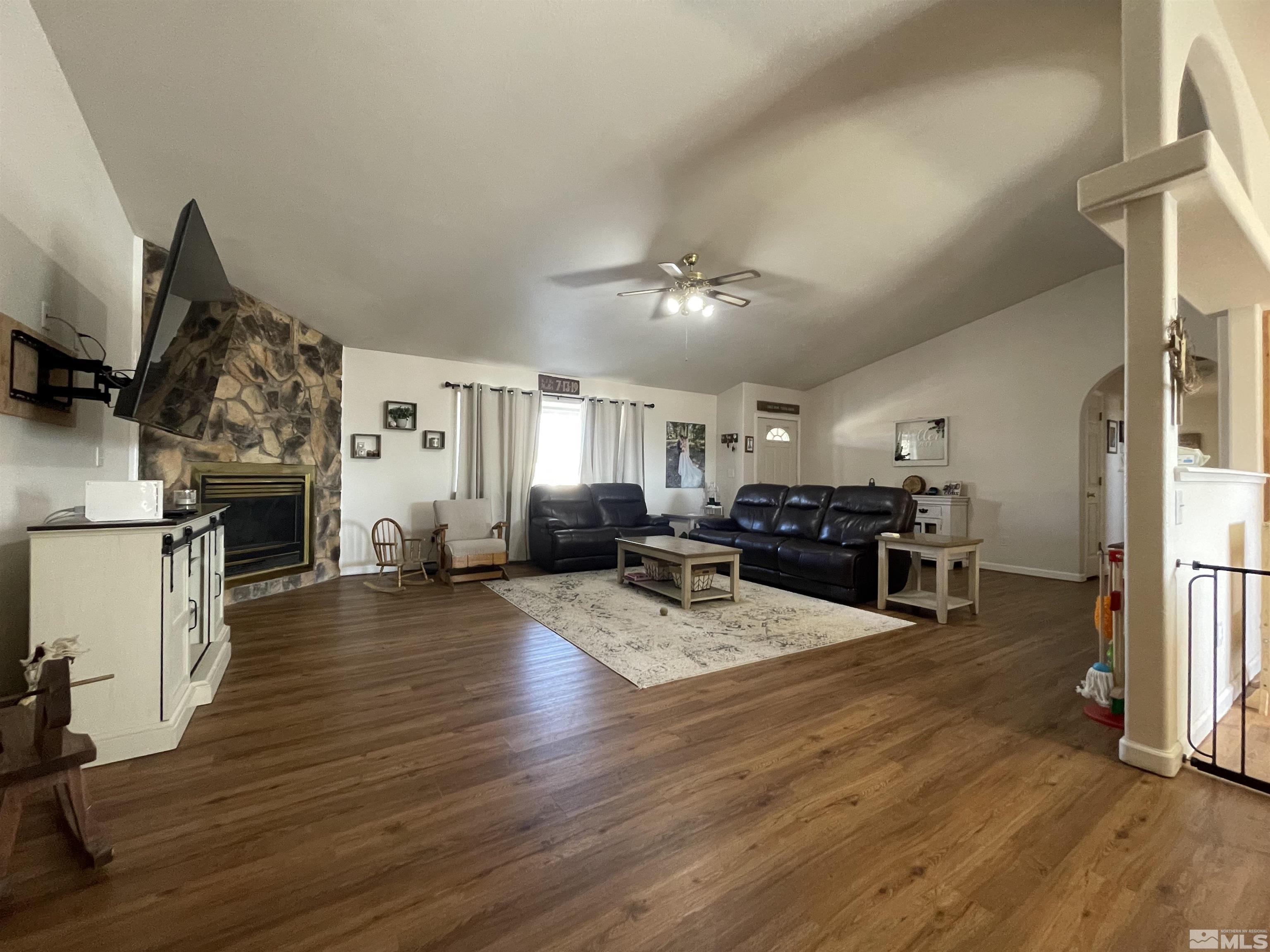 17 Mason Road Yerington, NV 89447 - Photo 5 of 36 a living room with furniture and a fireplace