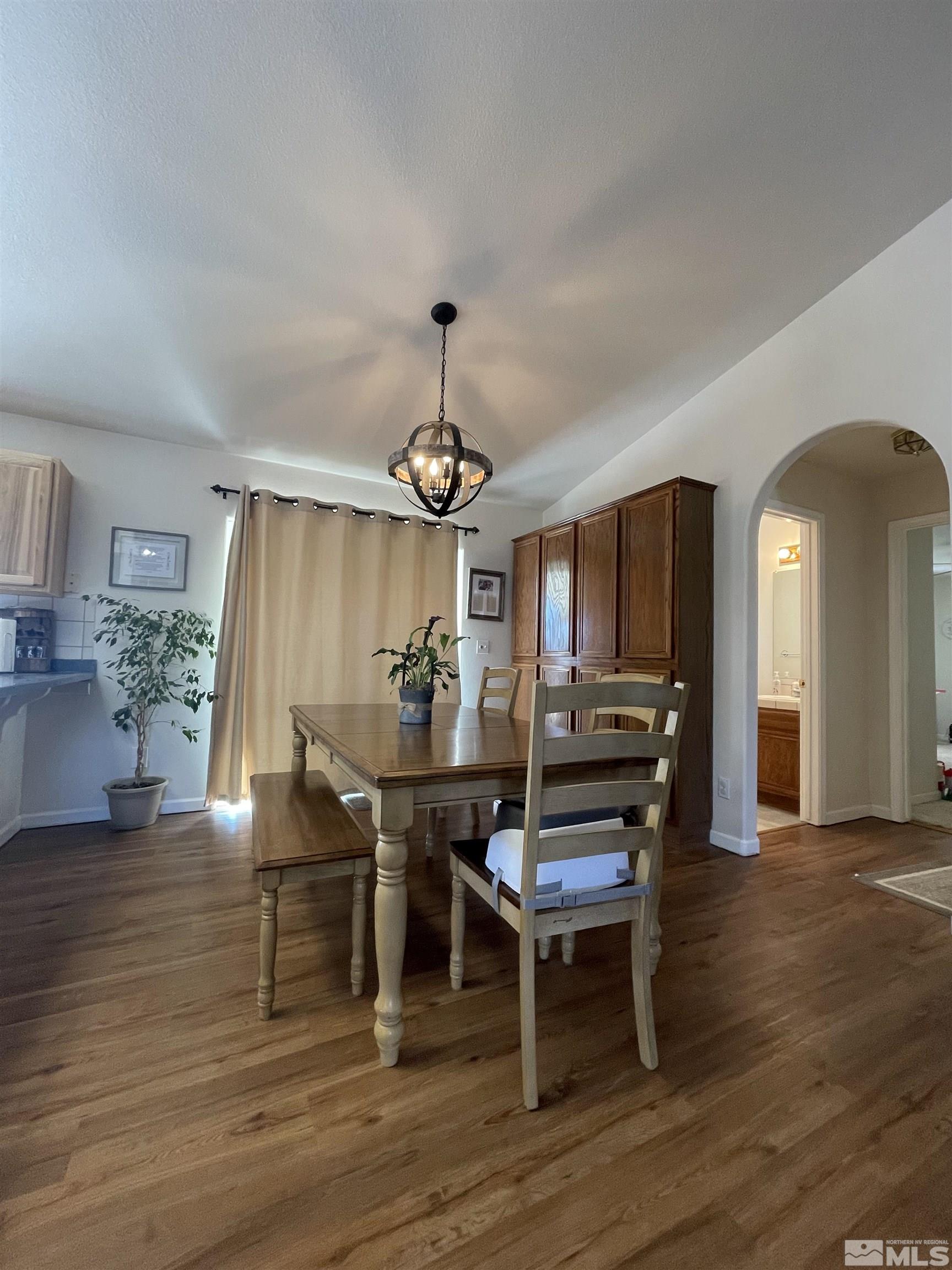 17 Mason Road Yerington, NV 89447 - Photo 9 of 36 a view of a dining room with furniture and wooden floor