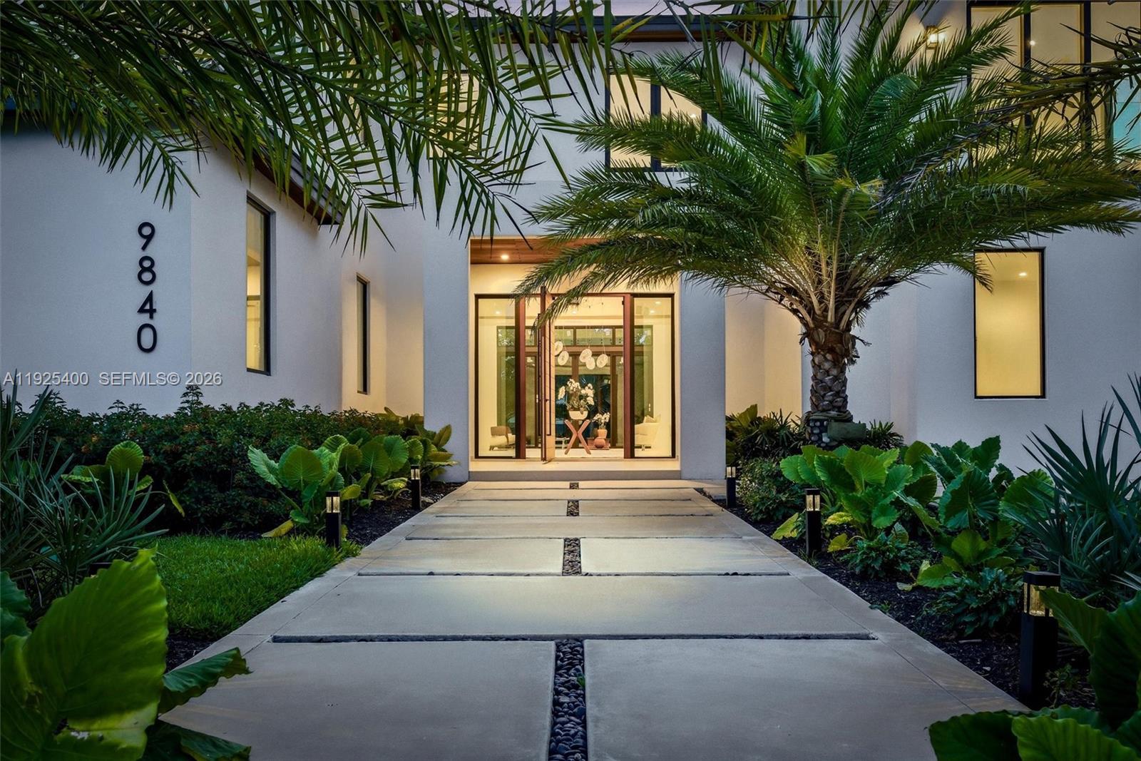 9840 Southwest 73rd Court Pinecrest, FL 33156 - Photo 1 of 67 Grand Entry | Pivot Door | Tropical Landscaping | Pathway Lighting | Pinecrest FL