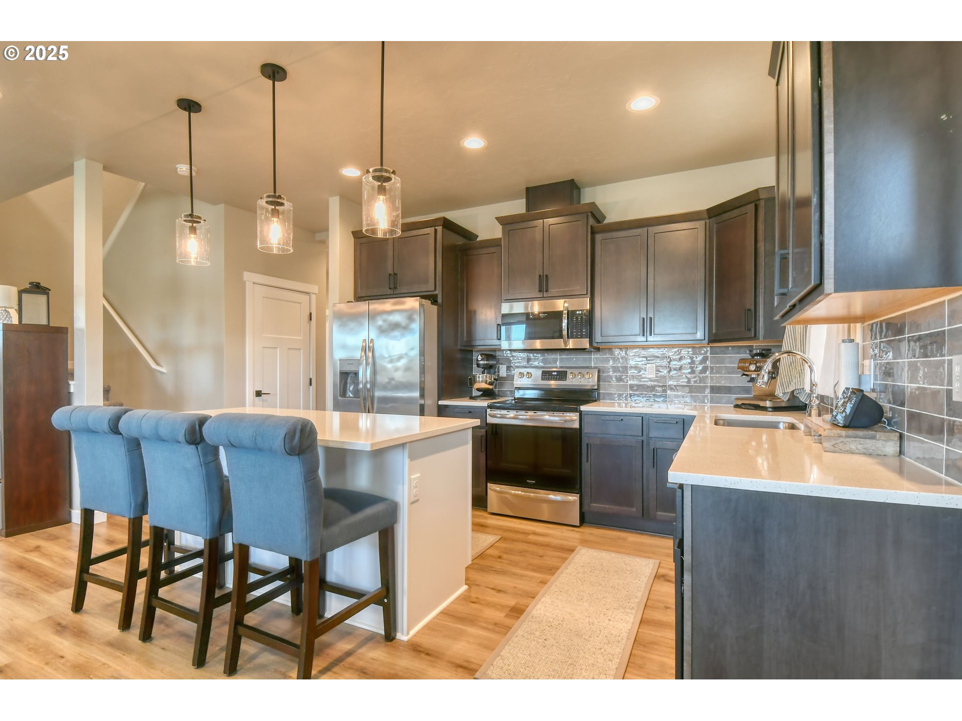 2 Lewis Circle Milton Freewater, OR 97862 - Photo 13 of 47 a kitchen with kitchen island granite countertop wooden cabinets and a granite counter tops