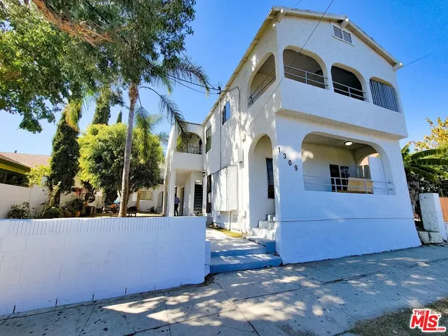 a view of a building with a yard