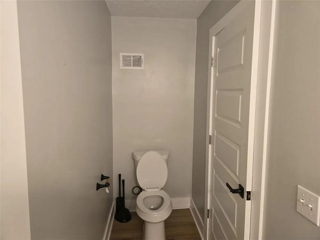 1117-1119 Spring Garden Avenue Pittsburgh, PA 15212 - Photo 17 of 27 a bathroom with a toilet and a sink