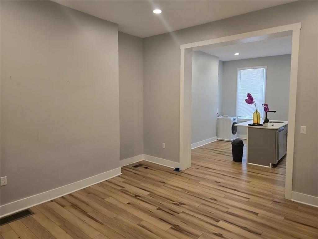 1117-1119 Spring Garden Avenue Pittsburgh, PA 15212 - Photo 21 of 27 a view of a room with wooden floor and furniture