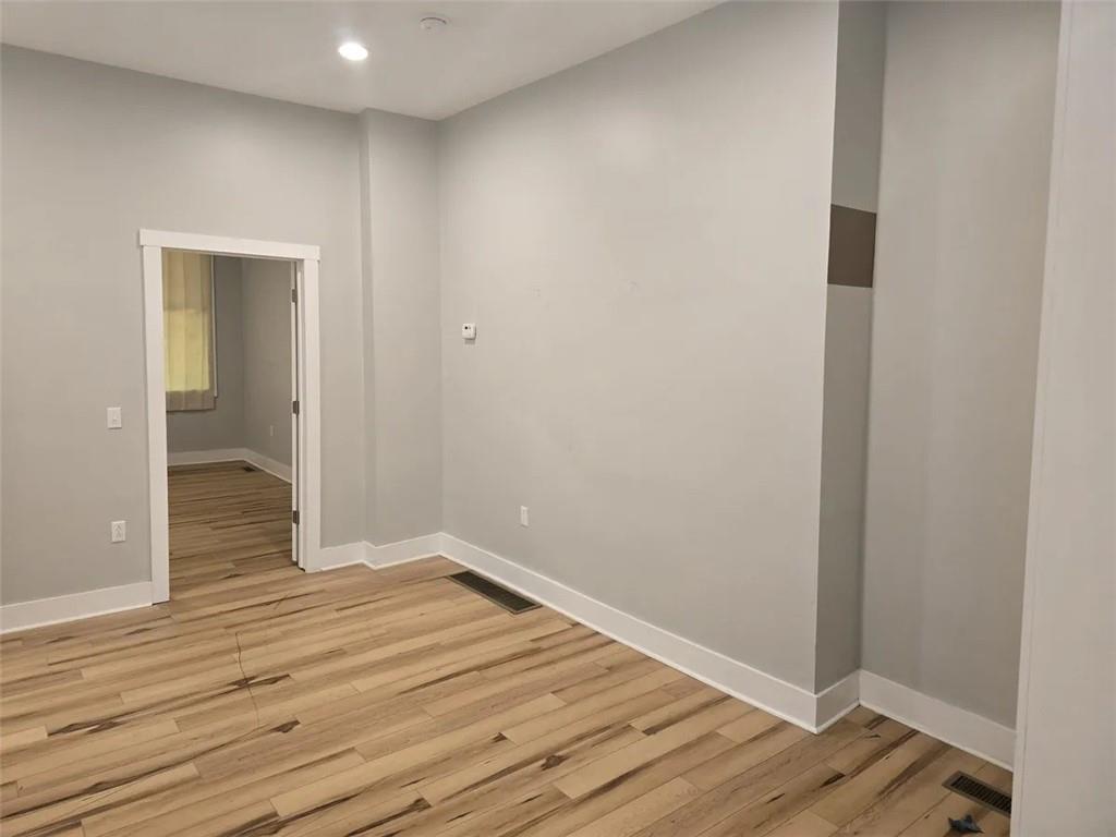 1117-1119 Spring Garden Avenue Pittsburgh, PA 15212 - Photo 22 of 27 a view of a hallway with wooden floor