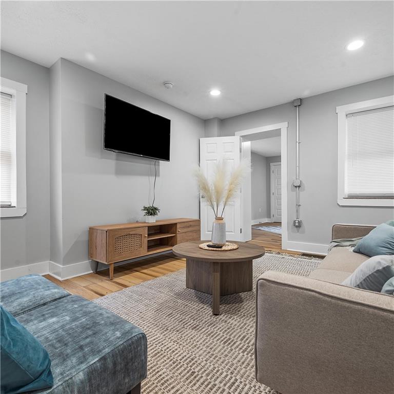 1117-1119 Spring Garden Avenue Pittsburgh, PA 15212 - Photo 3 of 27 a living room with furniture and a flat screen tv