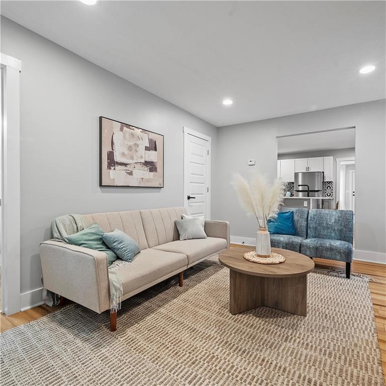 1117-1119 Spring Garden Avenue Pittsburgh, PA 15212 - Photo 7 of 27 a living room with furniture and a rug