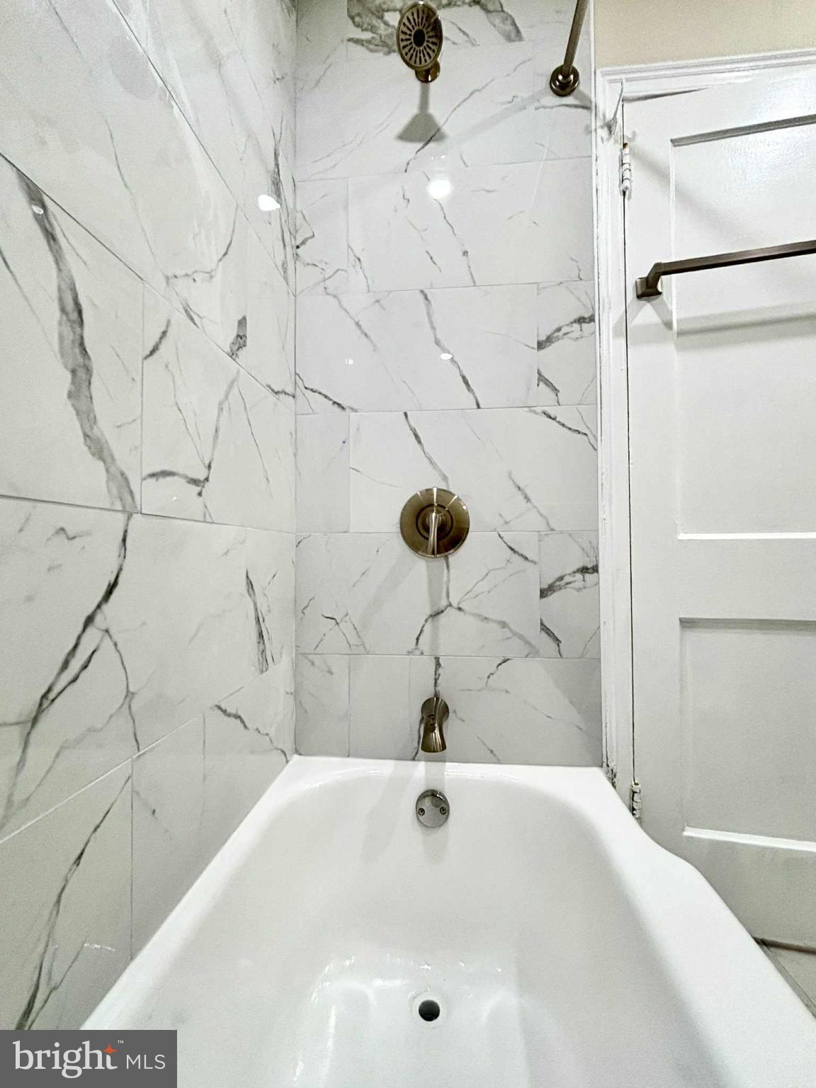 6644 Hollis Street, Unit 1 Philadelphia, PA 19138 - Photo 12 of 14 a bathroom with a bathtub