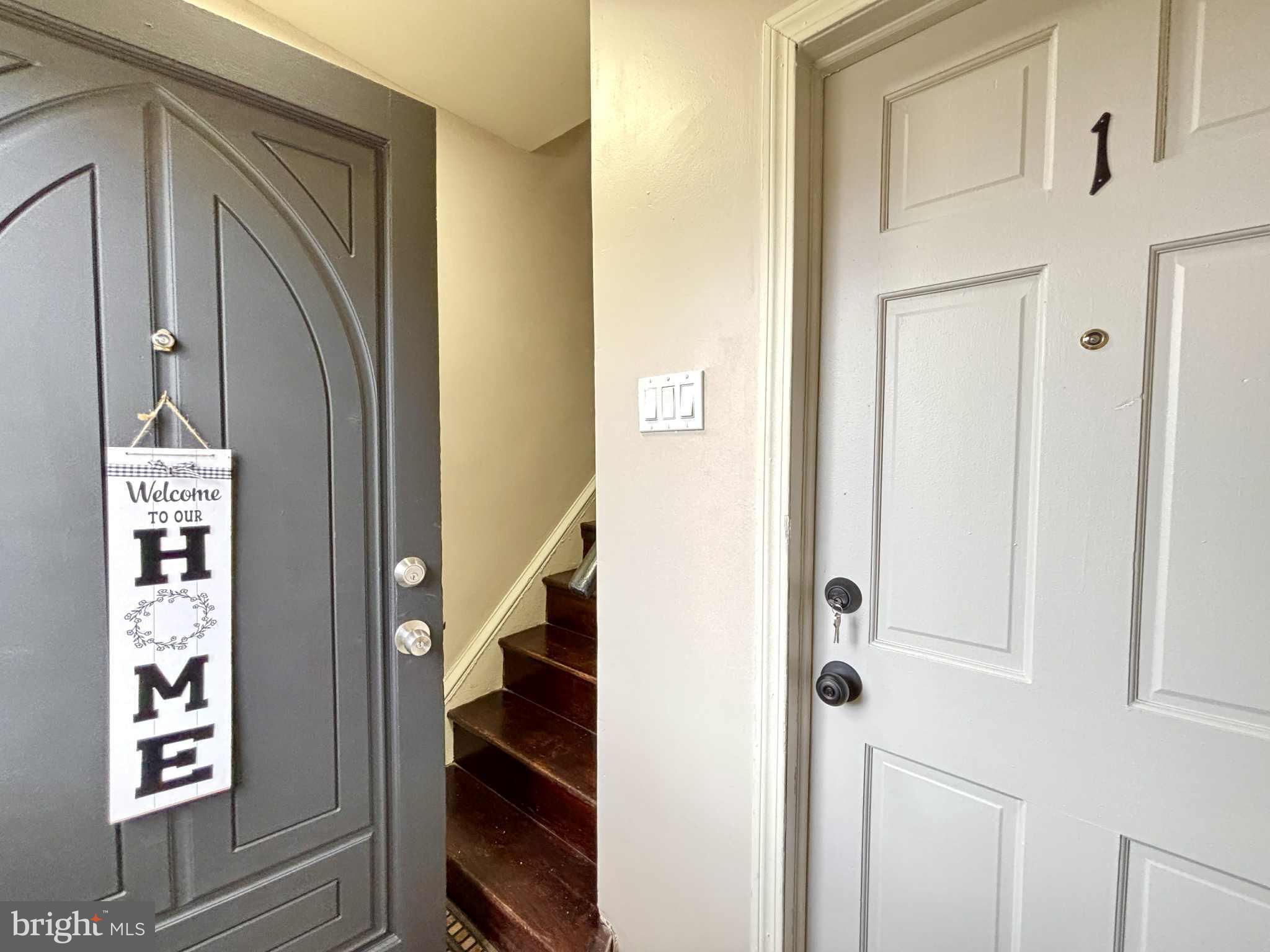 6644 Hollis Street, Unit 1 Philadelphia, PA 19138 - Photo 4 of 14 a view of hallway with stairs and wooden floor