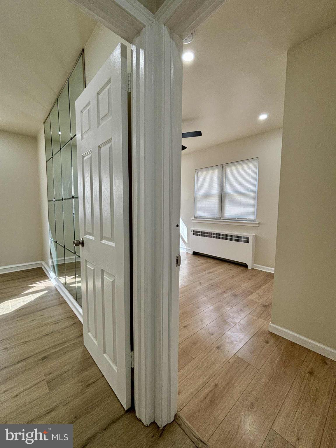 6644 Hollis Street, Unit 1 Philadelphia, PA 19138 - Photo 9 of 14 a view of a hallway with wooden floor and staircase