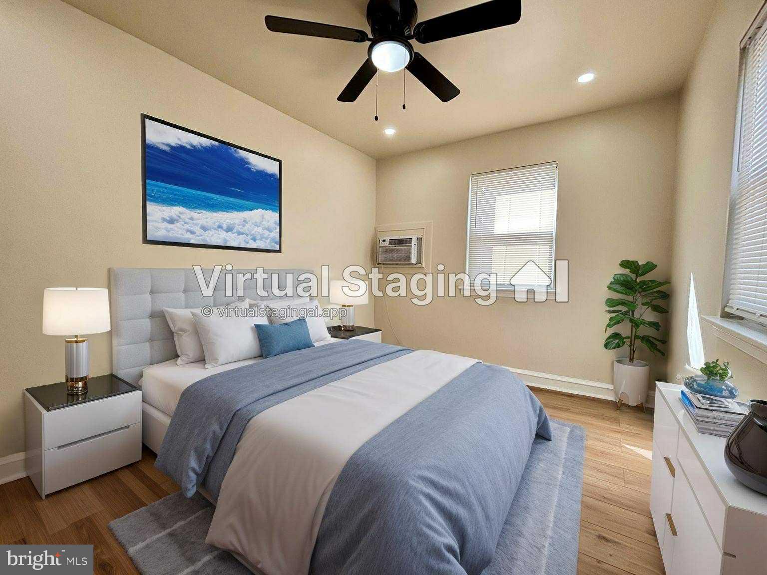 6644 Hollis Street, Unit 1 Philadelphia, PA 19138 - Photo 10 of 14 a spacious bedroom with a bed and a couch