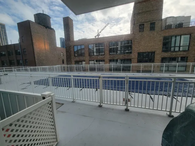 a view of balcony with furniture