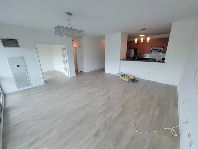 a view of a livingroom with furniture and wooden floor