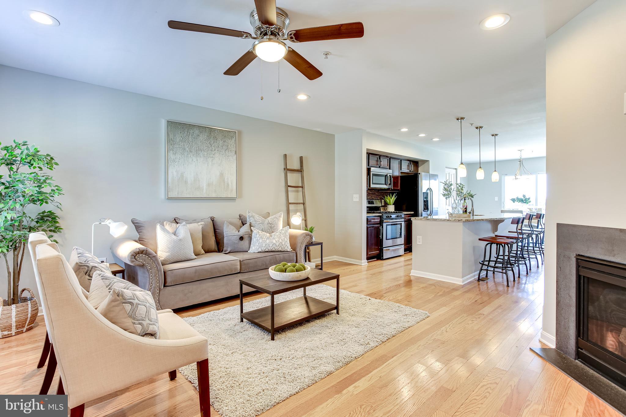 4603 Dillon Street Baltimore, MD 21224 - Photo 2 of 35 Bright Living Room Opens to Gourmet Kitchen