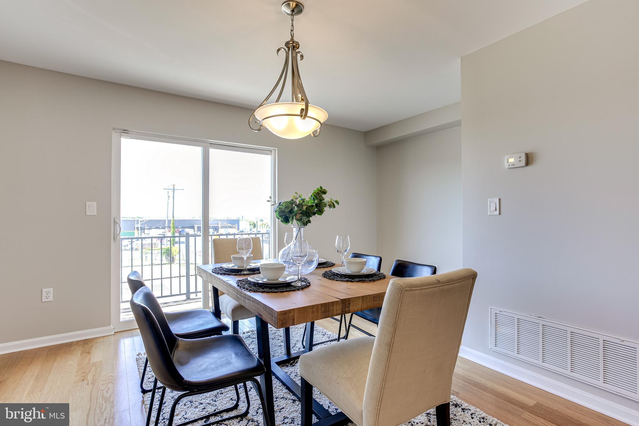 4603 Dillon Street Baltimore, MD 21224 - Photo 11 of 35 Dining Area w/ Sliders to Balcony
