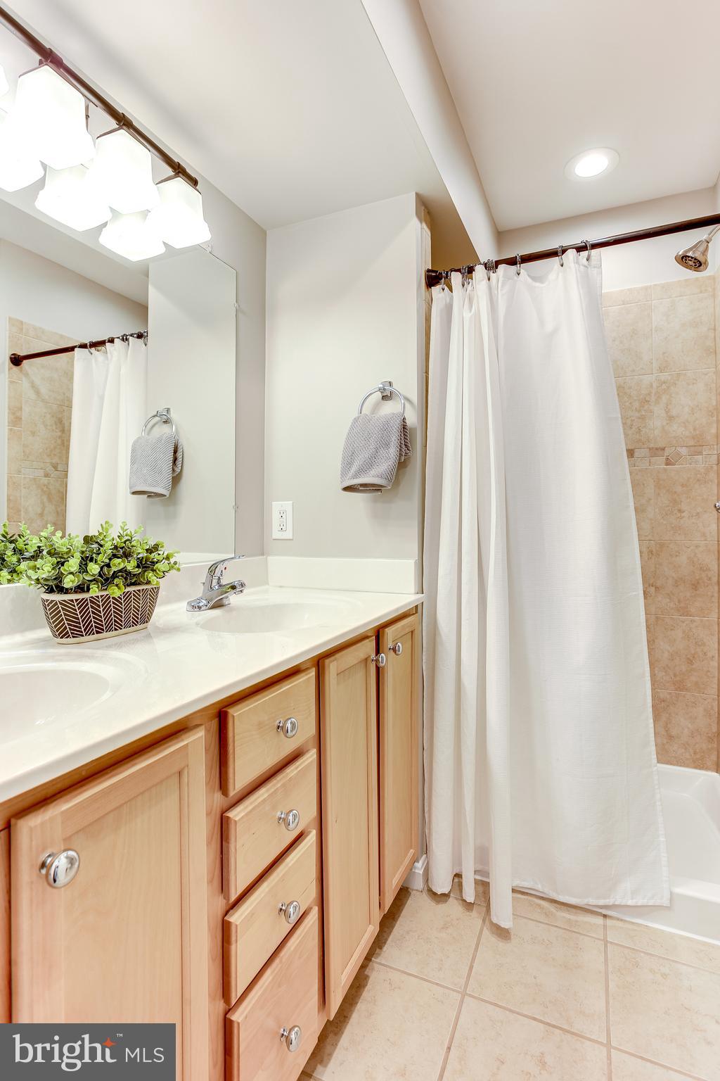 4603 Dillon Street Baltimore, MD 21224 - Photo 16 of 35 Primary Bath w/ Dual Vanities & Shower