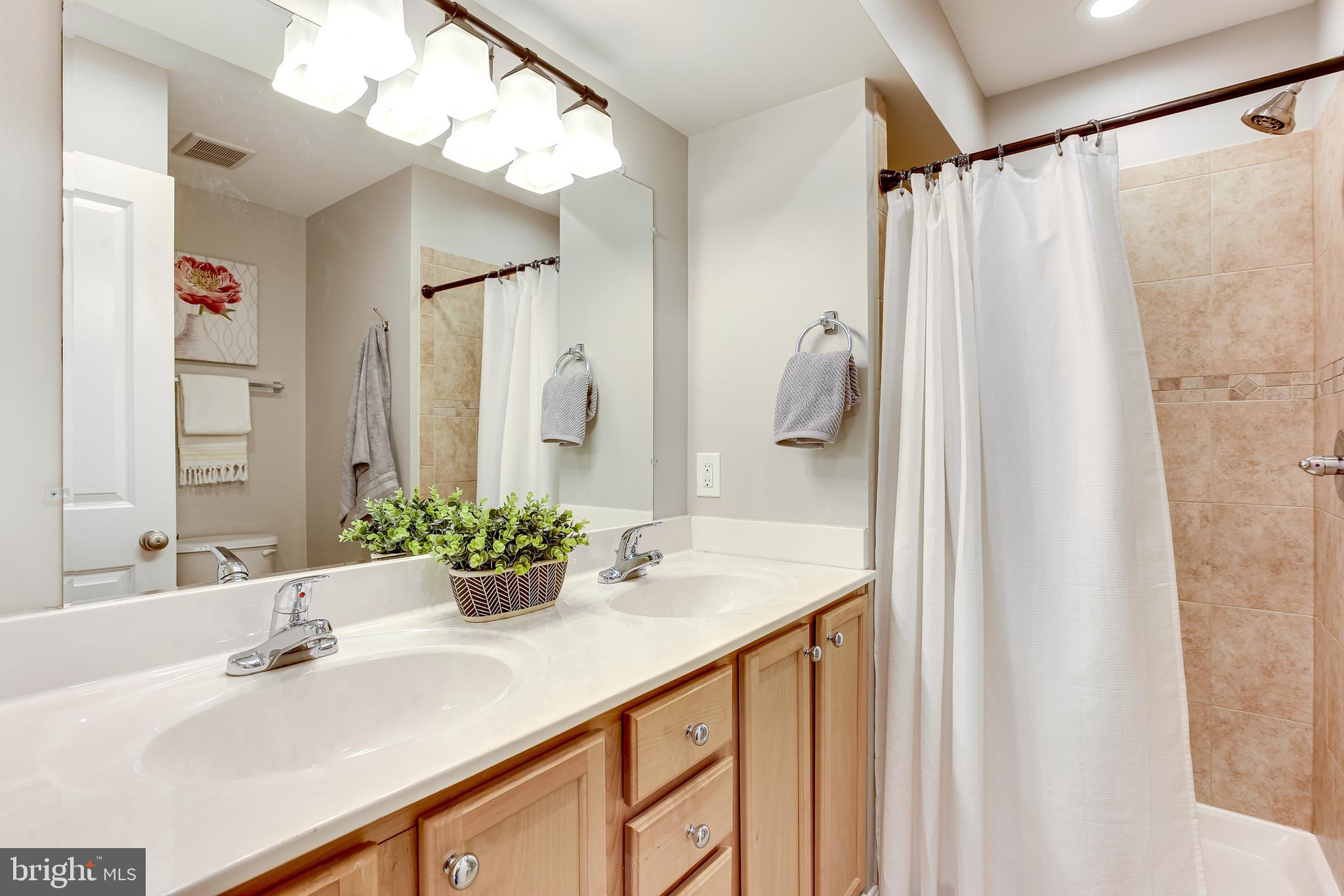 4603 Dillon Street Baltimore, MD 21224 - Photo 17 of 35 Primary Bath w/ Dual Vanities & Shower