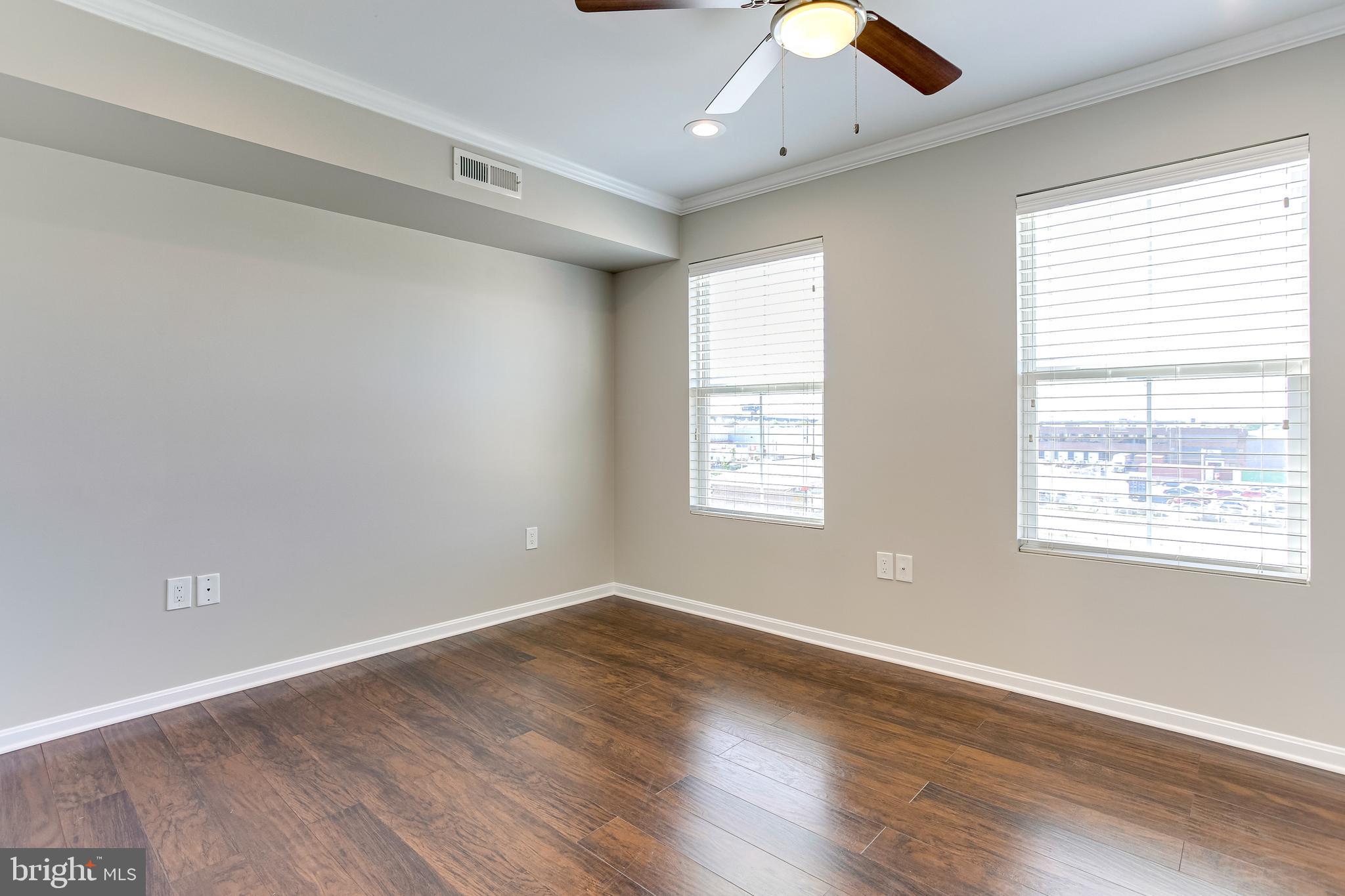 4603 Dillon Street Baltimore, MD 21224 - Photo 20 of 35 Bedroom 2 w/ Hardwood Floors & Ceiling Fan