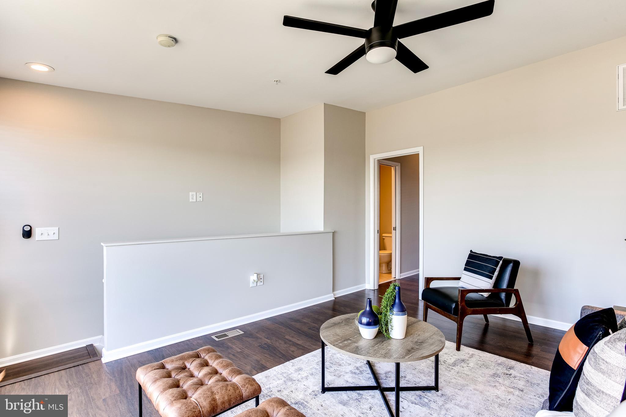 4603 Dillon Street Baltimore, MD 21224 - Photo 25 of 35 Upper Level Loft w/ Hardwood Floors & Ceiling Fan